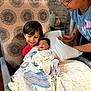 Carter is registered to the contest to win money with this photo: baby, blanket, care, chair, child, curtain, family, glasses, happy, holding, hospital, indoor, love, newborn, person, pillow, smile, support, towel, woman