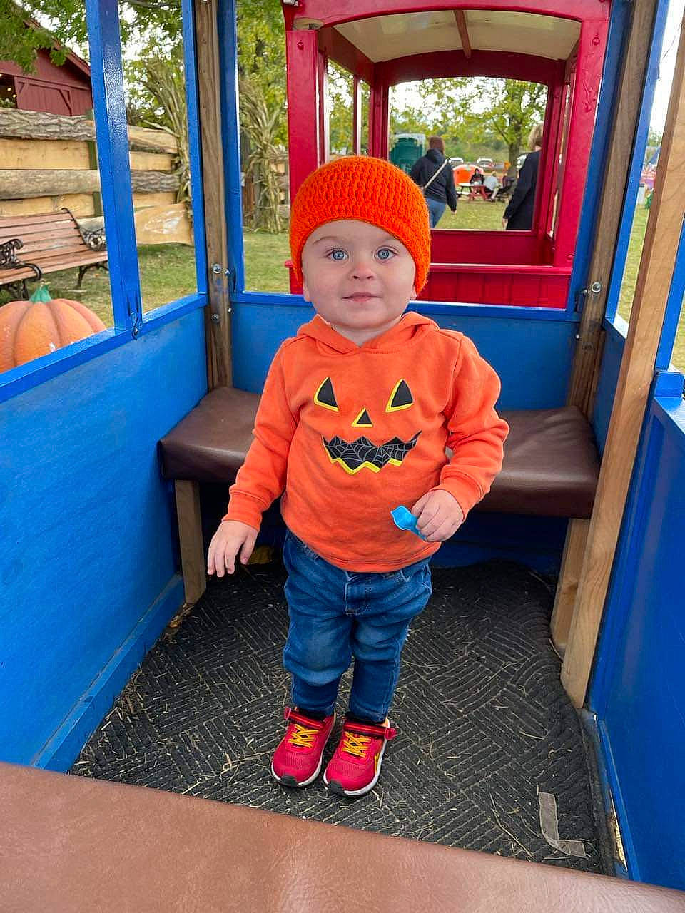Roman is registered to the contest to win money with this photo: azure, baby, baby_toddler_clothing, blue, child, city, electric_blue, fun, headwear, joy, leisure, orange, outdoor_play_equipment, person, plant, play, playground, recreation, red, standing