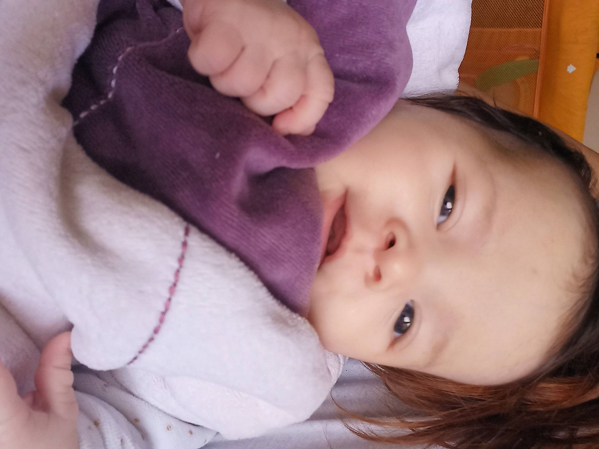 Roxane participe au concours pour gagner de l'argent avec cette photo : baby, baby_toddler_clothing, cheek, comfort, ear, eyebrow, eyelash, finger, forehead, gesture, happy, lip, mouth, neck, nose, person, pink, purple, skin, sleeve