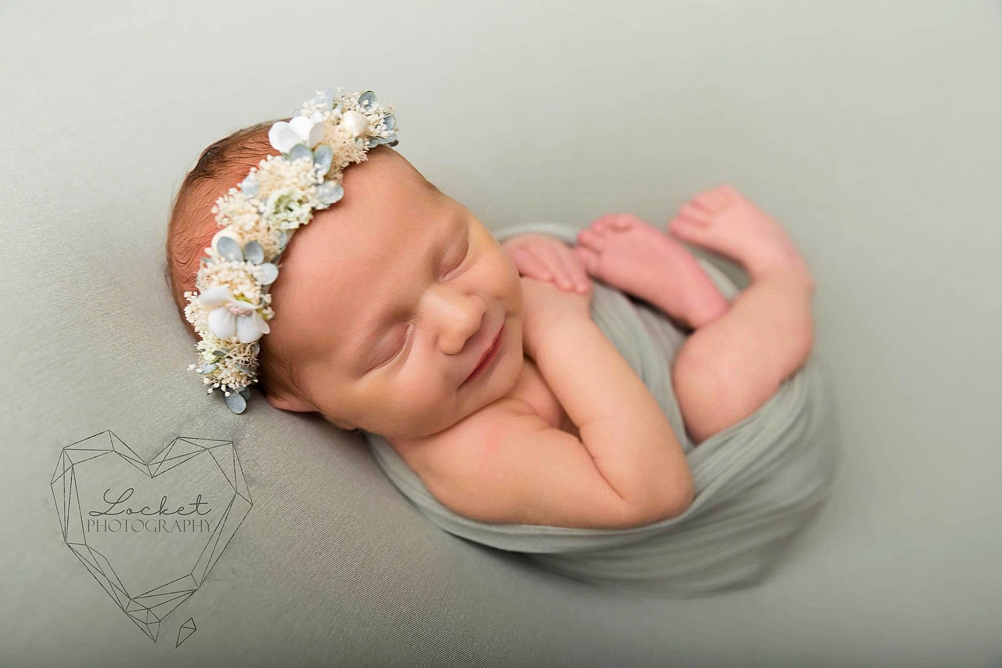 Scarlett is registered to the contest to win money with this photo: arm, baby, body_jewelry, bracelet, child, crown, eyelash, finger, gesture, hand, happy, headband, headgear, headpiece, headwear, jewellery, nail, person, petal, tiara