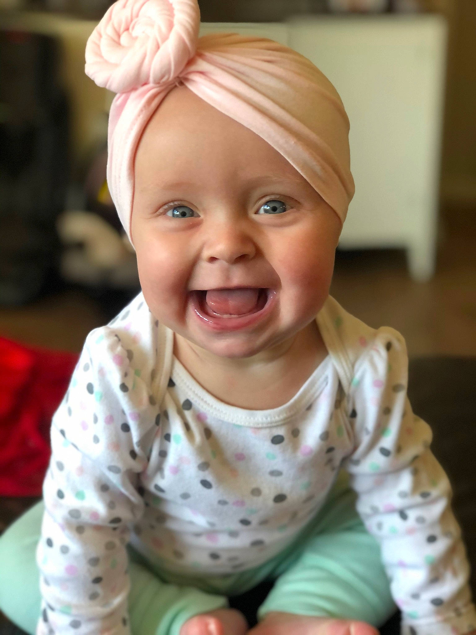 Kaylynn is registered to the contest to win money with this photo: arm, baby, baby_laughing, baby_making_funny_faces, baby_toddler_clothing, blond, cheek, child, crawling, eye, eyelash, face, hair_accessory, headwear, laugh, mouth, nose, person, pleased, skin