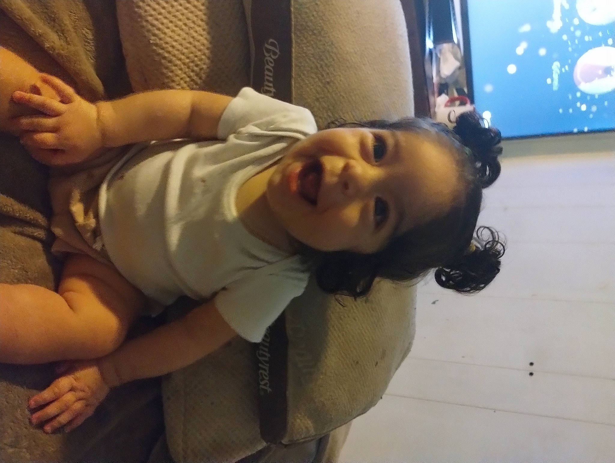 Kylie is registered to the contest to win money with this photo: abdomen, arm, black_hair, chest, comfort, elbow, eyebrow, flooring, fun, happy, human_body, human_leg, joint, knee, mouth, neck, nose, person, smile, thigh