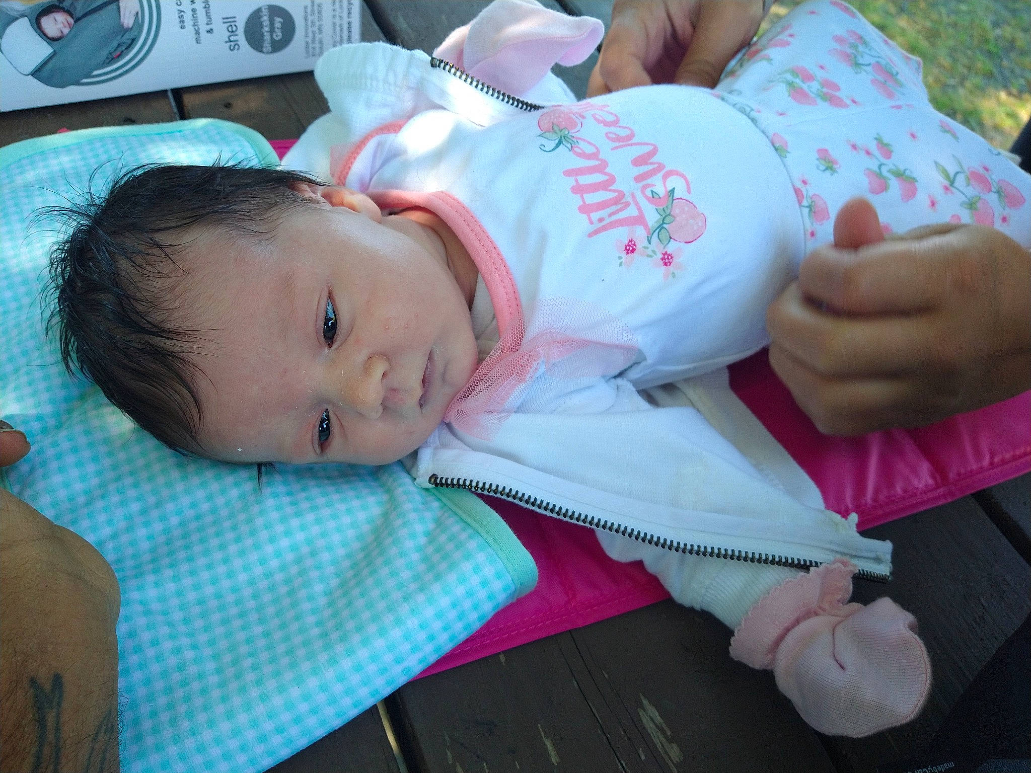 Sky'Lynn joined the competition — help win amazing prizes! abdomen, arm, baby, baby_products, baby_toddler_clothing, carmine, cheek, child, comfort, elbow, finger, grass, hand, hat, lap, person, sitting, skin, sleeve, toddler