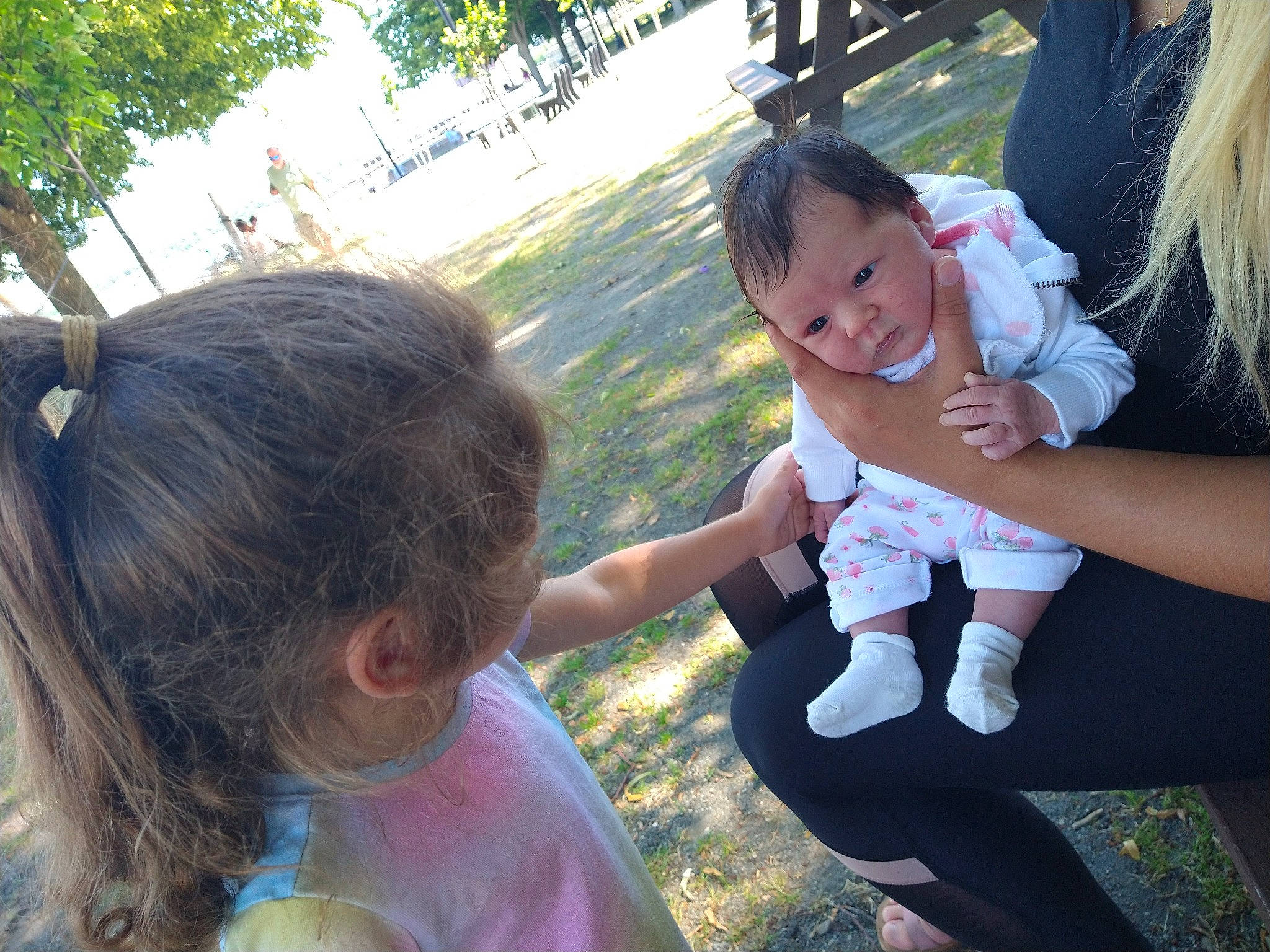 Sky'Lynn joined the competition — help win amazing prizes! child, event, fun, gesture, grass, grass_family, grassland, happy, interaction, leisure, people_in_nature, person, plant, recreation, sitting, skin, smile, t_shirt, thumb, toddler