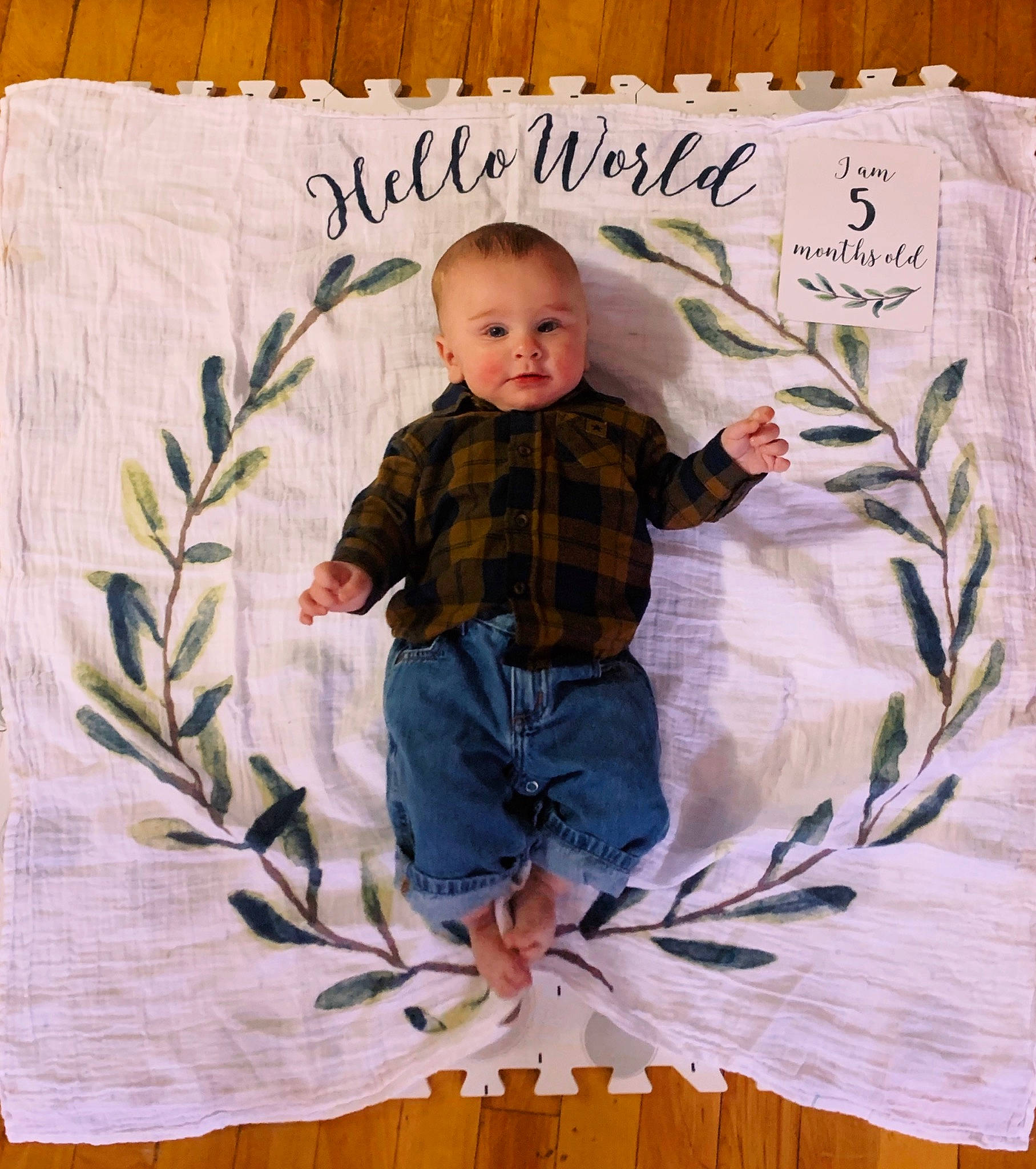 Malcolm joined the competition — help win amazing prizes! baby, baby_toddler_clothing, child, denim, happy, illustration, leaf, linens, paper_product, pattern, person, plaid, plant, sleeve, t_shirt, tartan, textile, toddler, tree, wood