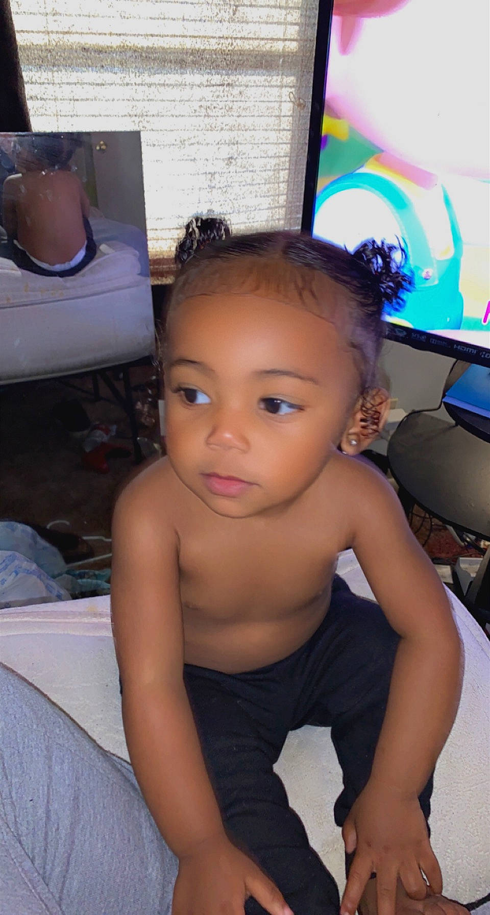 Kylah is registered to the contest to win money with this photo: black_hair, chair, cheek, chest, child, ear, eye, eyebrow, eyelash, flooring, fun, human_leg, kettle, person, room, sitting, skin, thigh, thumb, toddler