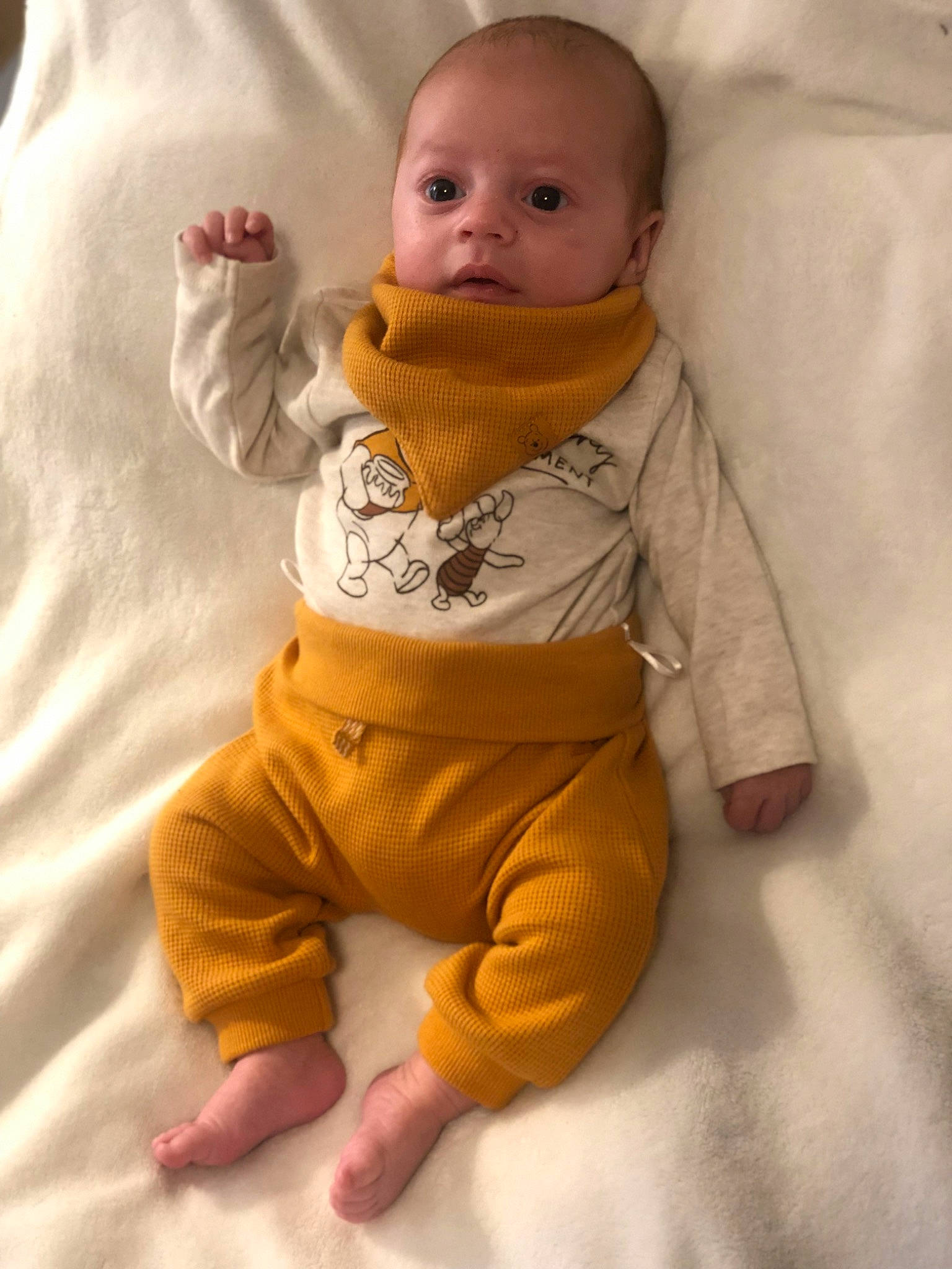 Edem participe au concours pour gagner de l'argent avec cette photo : baby, baby_safety, baby_sleeping, baby_toddler_clothing, cheek, chin, comfort, eye, face, flooring, gesture, happy, head, jacket, linens, nose, orange, person, skin, sleeve