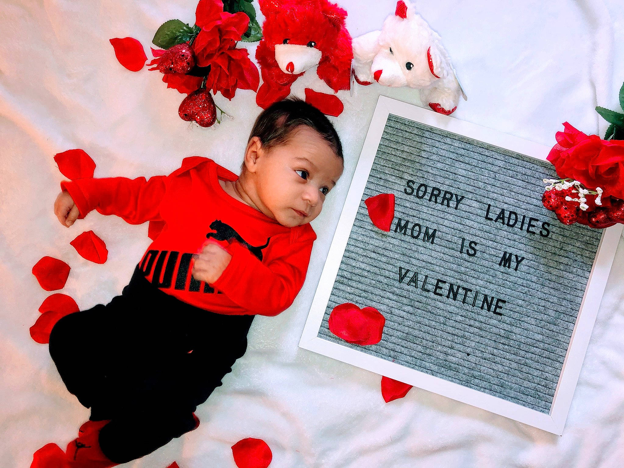 Kalvin joined the competition — help win amazing prizes! artificial_flower, baby, child, flower, happy, person, petal, plant, red, smile, toddler