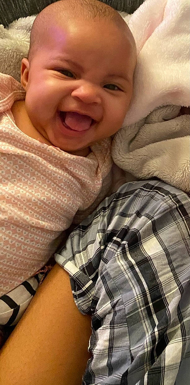 Nariyah is registered to the contest to win money with this photo: baby, cheek, child, face, facial_expression, happy, lip, nap, nose, pattern, person, skin, sleep, smile, toddler