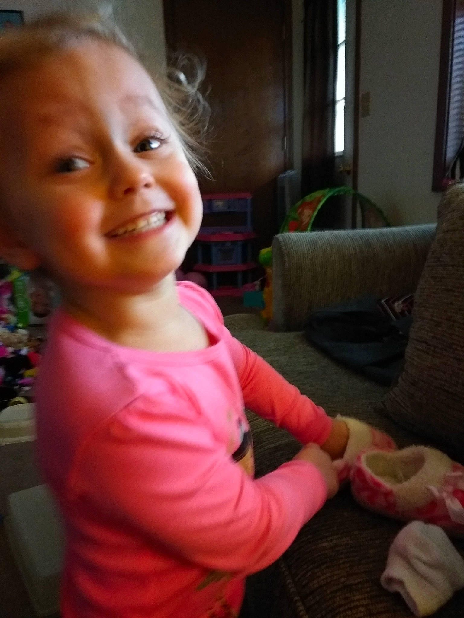 Karlee is registered to the contest to win money with this photo: baby, baby_toddler_clothing, blond, child, couch, curtain, daylighting, joy, living_room, person, pillow, pink, room, slipcover, stuffed_toy, throw_pillow, thumb, tooth, window, window_blind