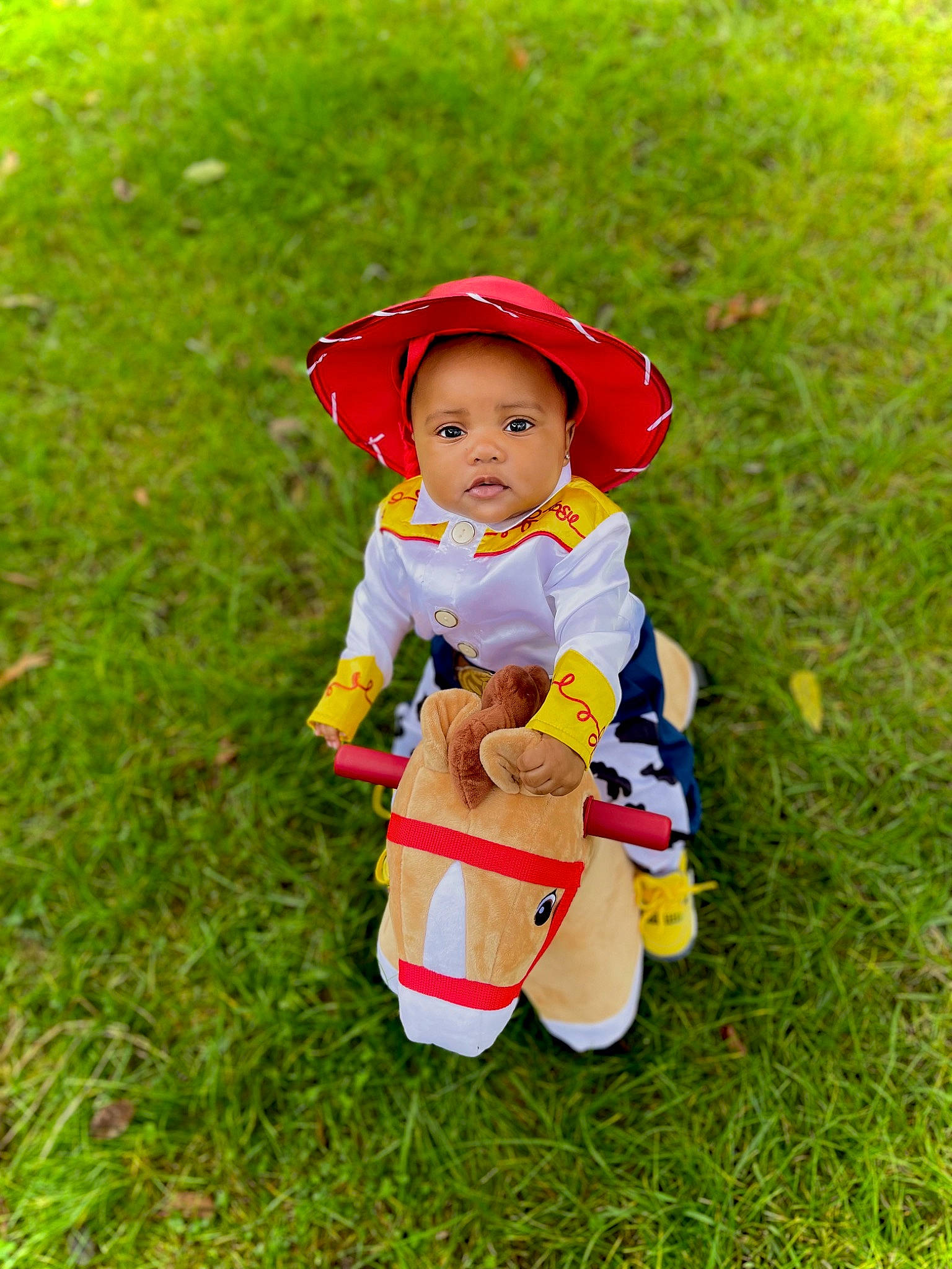 Raynyah joined the competition — help win amazing prizes! baby, baby_toddler_clothing, cap, fictional_character, fun, garden, grass, grassland, happy, hat, lawn, lawn_ornament, people_in_nature, person, plant, recreation, sitting, sun_hat, toddler, toy