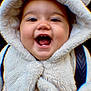 baby, child, smiling, happy, hood, jacket, fur, cute, portrait, face, teeth, closeup, warm_clothing, infant, person, outdoor, expression, joy, fun, small