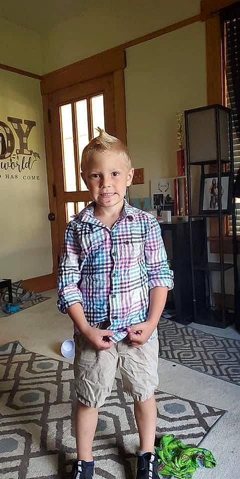 Mayson joined the competition — help win amazing prizes! bermuda_shorts, board_short, child, dress_shirt, electric_blue, eyewear, flooring, fun, joy, pattern, person, plaid, shelf, shorts, shoulder, sitting, sleeve, standing, street_fashion, t_shirt