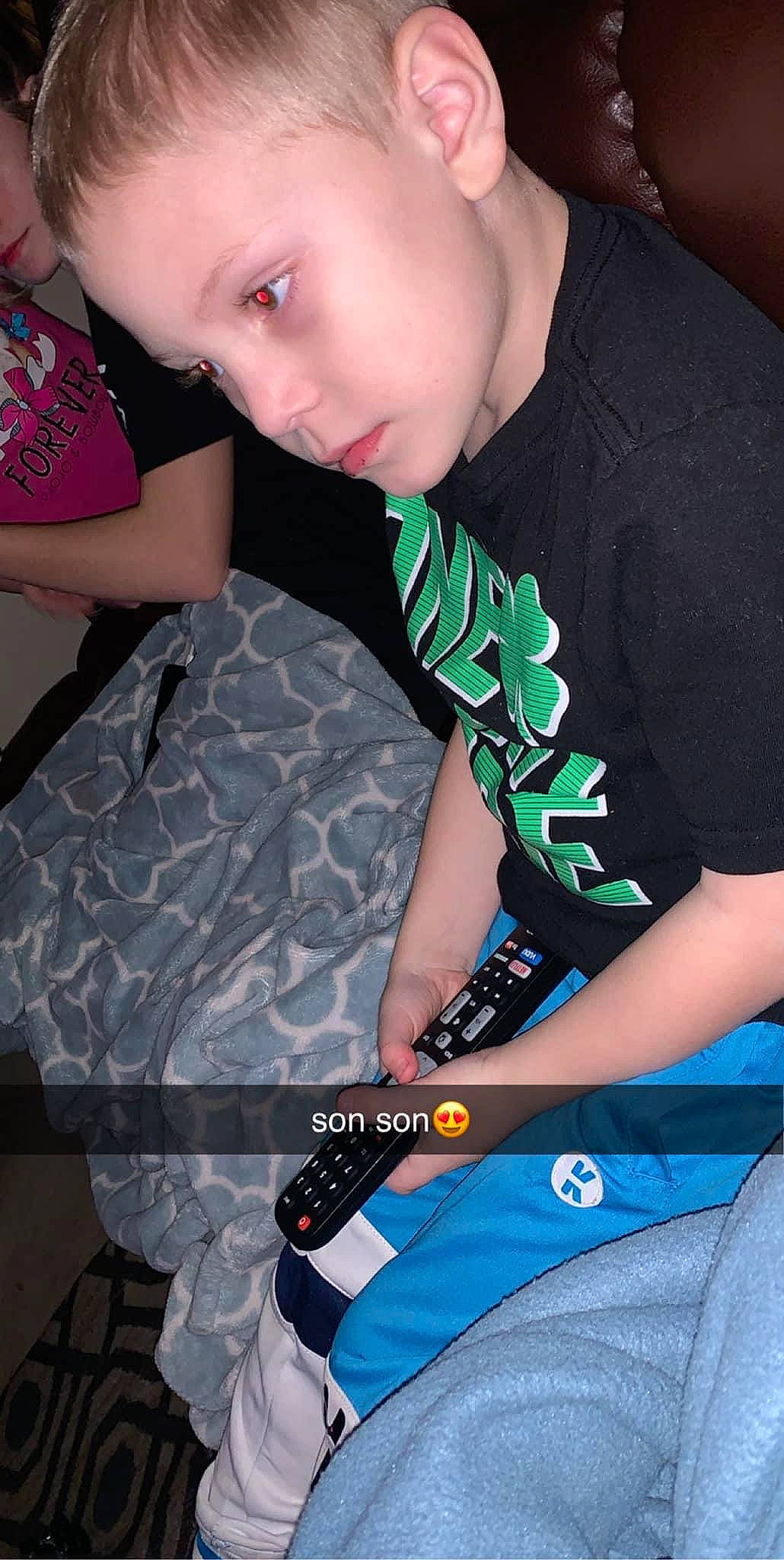 Mayson is registered to the contest to win money with this photo: arm, black_hair, chest, child, cool, elbow, electric_blue, eyelash, fashion_design, fun, happy, joint, neck, pattern, person, sitting, sleeve, sportswear, t_shirt, thigh