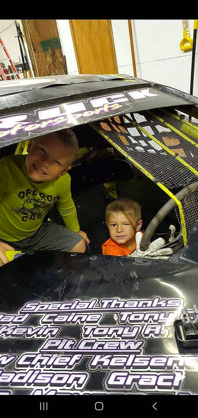 Jackson is registered to the contest to win money with this photo: automotive_design, automotive_exterior, automotive_lighting, automotive_tire, black, bumper, child, cool, fun, hood, joy, leisure, light, motor_vehicle, person, photograph, product, snapshot, t_shirt, toddler