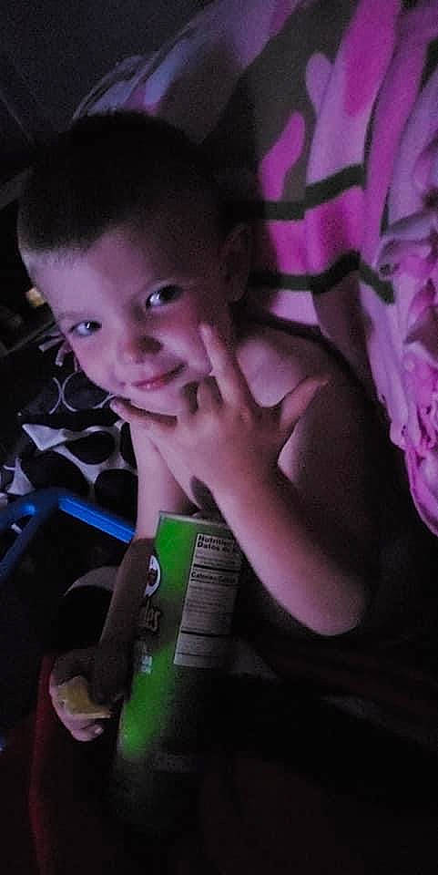 Ryder is registered to the contest to win money with this photo: audio_equipment, black_hair, child, cool, darkness, electric_blue, finger, flash_photography, fun, gadget, gesture, hairstyle, happy, input_device, muscle, person, plant, purple, thumb, toddler