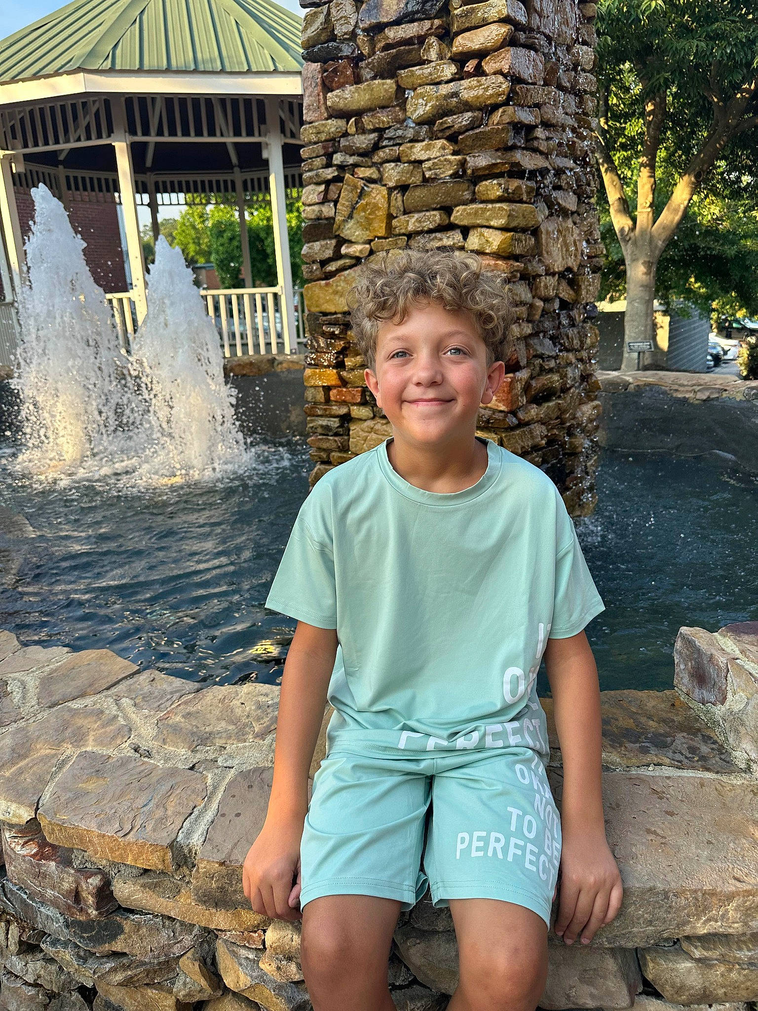 Marcus joined the competition — help win amazing prizes! chute, fountain, fun, green, happy, joy, leisure, person, recreation, rock, smile, spring, standing, summer, t_shirt, temple, tourism, travel, tree, water