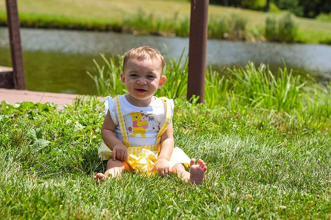 Savannah is registered to the contest to win money with this photo: baby, baby_toddler_clothing, child, fun, garden, grass, grass_family, grassland, groundcover, happy, lake, lawn, leisure, people_in_nature, person, plant, sitting, smile, spring, toddler