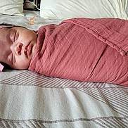 Idalyz joined the competition — help win amazing prizes! baby, sleeping, swaddled, headband, bow, blanket, bed, bedspread, soft, peaceful, infant, child, cute, resting, indoors, person, portrait, newborn, pink, cozy