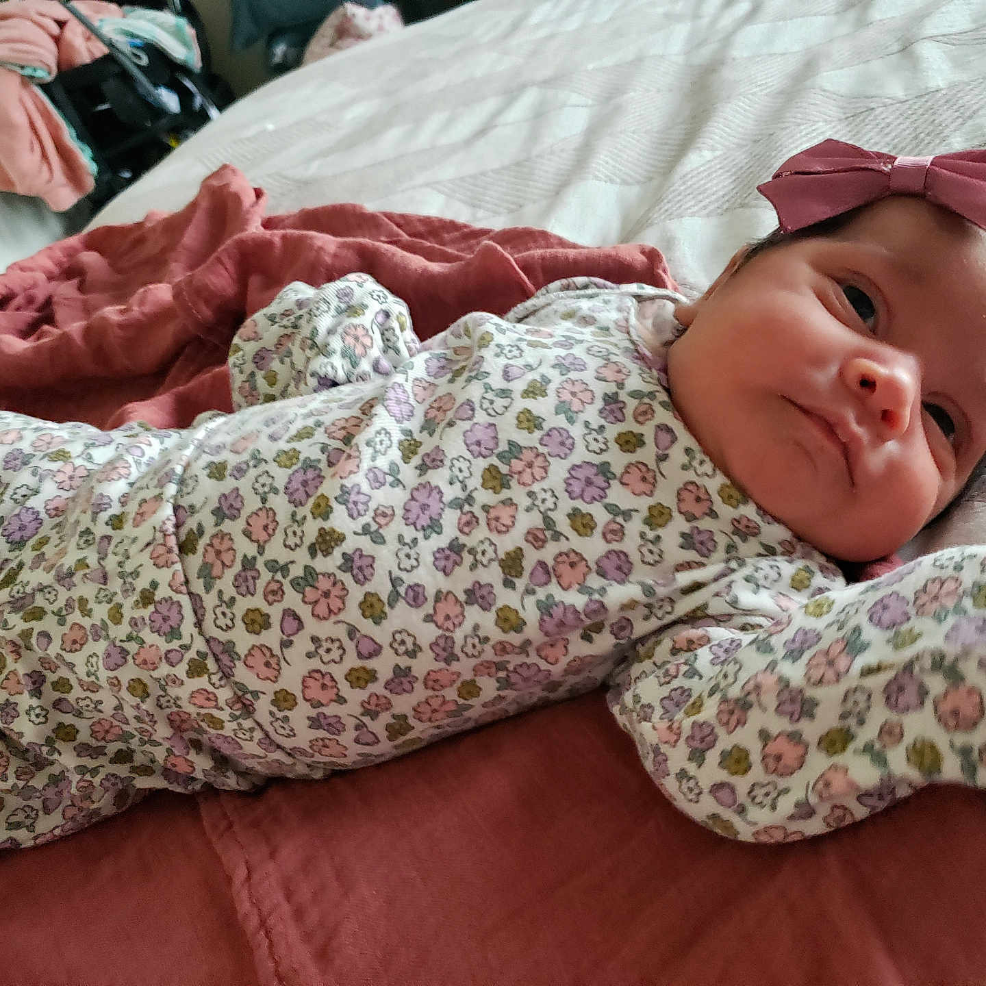 Idalyz is registered to the contest to win money with this photo: baby, bed, blanket, bow, child, clothing, cute, face, flower_pattern, headband, indoors, infant, newborn, person, pink, portrait, resting, skin, sleepwear, soft_fabric