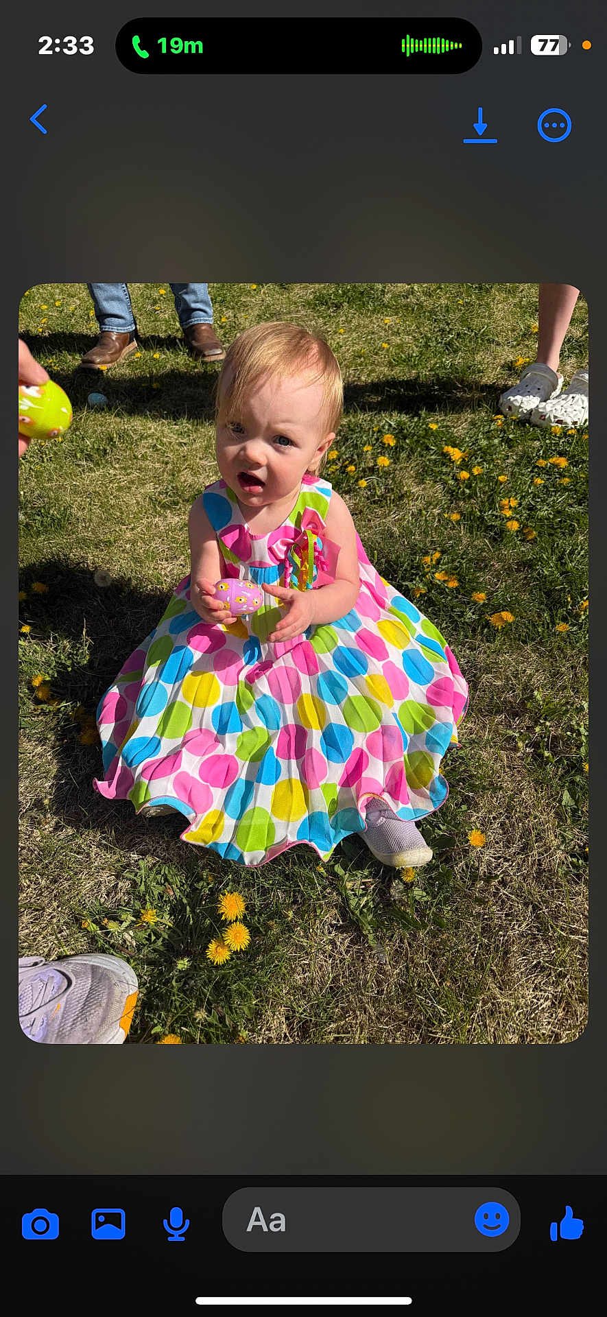 Alivia is registered to the contest to win money with this photo: child, toddler, girl, colorful_dress, polka_dot, sitting, grass, dandelion, easter_egg, outdoor, sunlight, shoes, hand, portrait, surprised_expression, casual_shoes, patterned_clothing, flower_field, playtime, people_legs