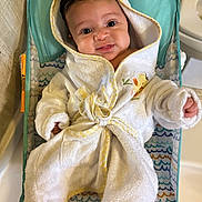 Kaliana joined the competition — help win amazing prizes! baby, bathroom, bonnet, clothing, face, happy, hat, head, hood, hoodie, indoors, knitwear, person, photography, portrait, room, smile, sweater, sweatshirt, toilet