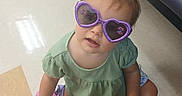 Aurora joined the competition — help win amazing prizes! accessories, baby, boot, clothing, couch, face, footwear, furniture, glasses, goggles, head, person, photography, portrait, purple, shoe, sitting, sneaker, sunglasses, table