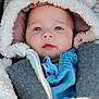 baby, child, face, blue_eyes, hooded_jacket, fluffy, pom_poms, pacifier, denim, clothing, cute, close_up, winter_wear, infant, portrait, warm, soft_texture, outdoor, young_child, adorable