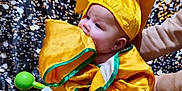 Ivy joined the competition — help win amazing prizes! baby, blanket, celebration, chewing, child, colorful_background, cute, fabric, floor, graduation_cap, graduation_gown, indoor, infant, person, portrait, sitting, smiling, soft_toy, supporting_hand, yellow_clothing