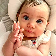 Olena is registered to the contest to win money with this photo: baby, biting, blonde, bodypart, cushion, face, finger, hair, hand, happy, head, homedecor, newborn, person, photography, portrait, smile, wrist