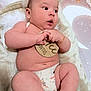 baby, infant, diaper, blanket, fur_hat, milestone_disc, bracelet, chubby_legs, cute_expression, face, eyes, hands, feet, soft_texture, nursery_background, plush, skin, portrait, lying_down, newborn
