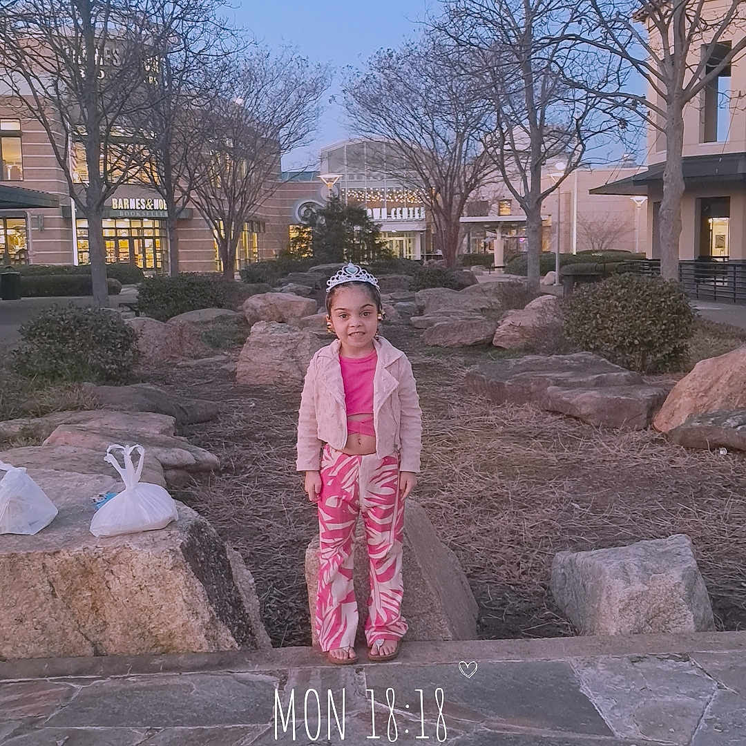 A'Monie joined the competition — help win amazing prizes! architecture, building, child, clothing, dress, face, fashion, female, flagstone, formalwear, girl, gown, head, pants, path, person, photography, road, slate, walkway