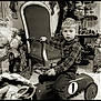 Kenzo participe au concours pour gagner de l'argent avec cette photo : black_and_white, bow_tie, boy, carpet, chair, child, christmas, classic, decor, face, holiday_decorations, indoor, plaid_shirt, portrait, presents, santa_figure, steering_wheel, toy_car, vintage, young_child
