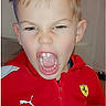 Kenzo participe au concours pour gagner de l'argent avec cette photo : boy, casual_clothing, child, closeup, emotion, energetic, expression, face, ferrari_logo, indoor, light_skin, mouth_open, person, playful, portrait, puma_logo, red_jacket, short_hair, shouting, young