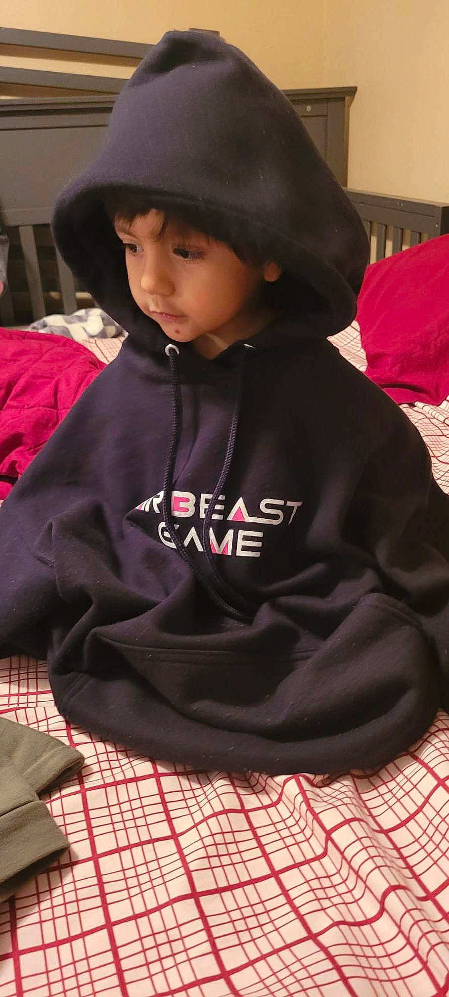 Aaron joined the competition — help win amazing prizes! black, cap, carmine, cool, costume, fashion_accessory, fur, hat, hood, hoodie, magenta, pattern, person, plaid, red, sitting, sleeve, sun_hat, t_shirt, tartan