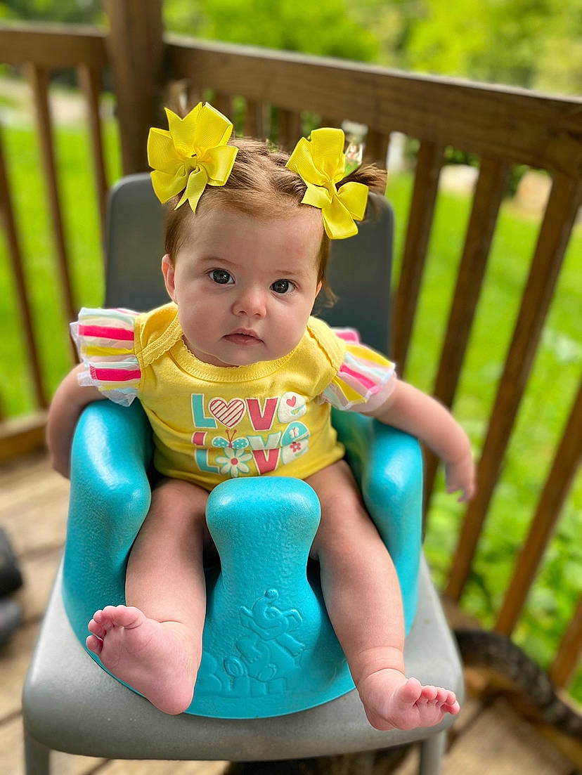 Maci joined the competition — help win amazing prizes! baby, baby_products, baby_toddler_clothing, chair, child, dress, furniture, hair_accessory, pattern, person, pink, play, sitting, skin, spring, summer, toddler, turquoise, vacation, yellow