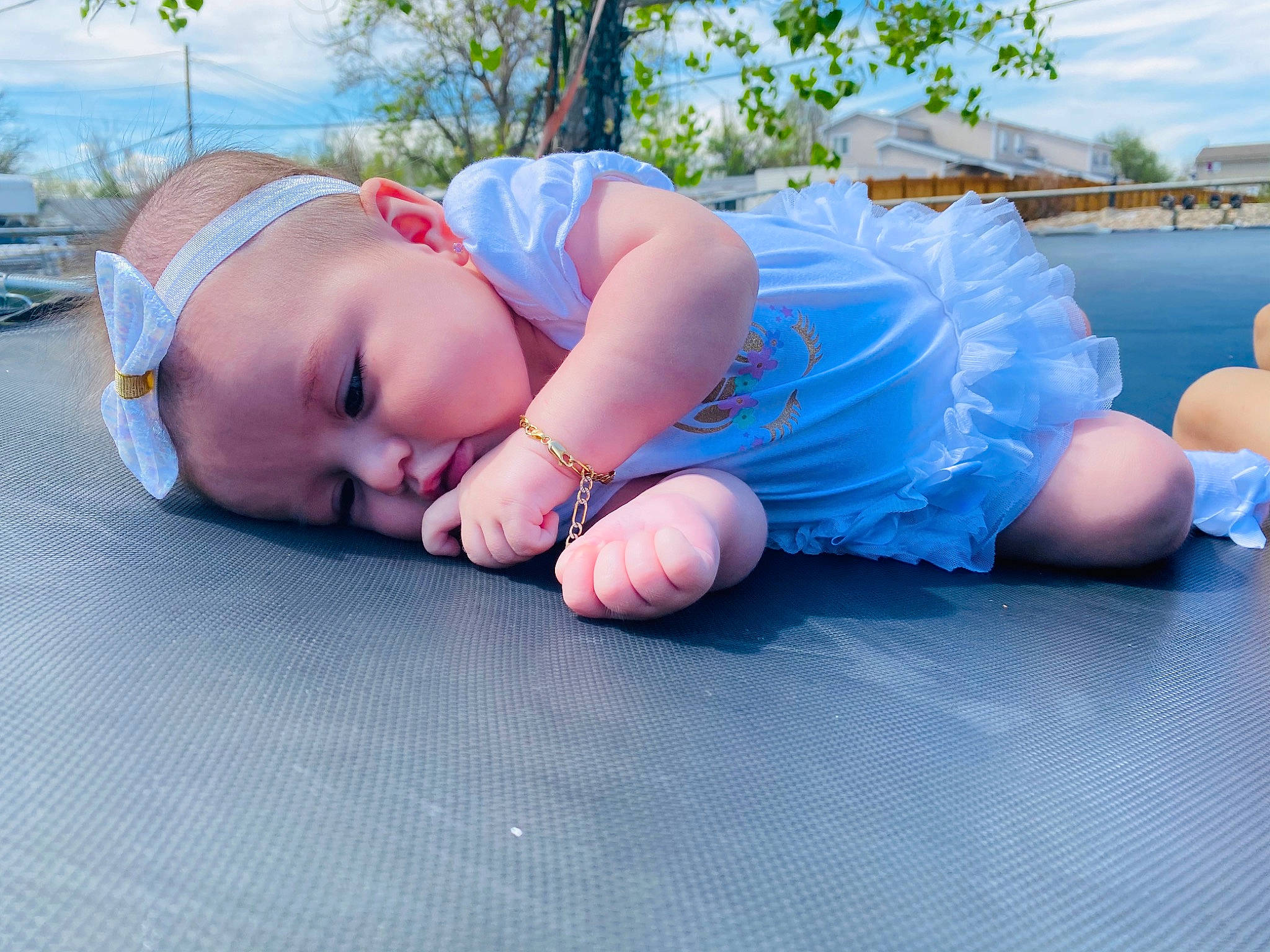 Aitana is registered to the contest to win money with this photo: arm, baby, blue, child, electric_blue, foot, hand, joint, knee, leg, leisure, person, pink, sitting, summer, toddler, vacation