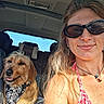 Dinky participe au concours pour gagner de l'argent avec cette photo : woman, dog, car, selfie, portrait, sunglasses, smiling, bandana, pet, companion, road_trip, vehicle, seated, indoor, sunlight, long_hair, necklace, fashion, happy, animal