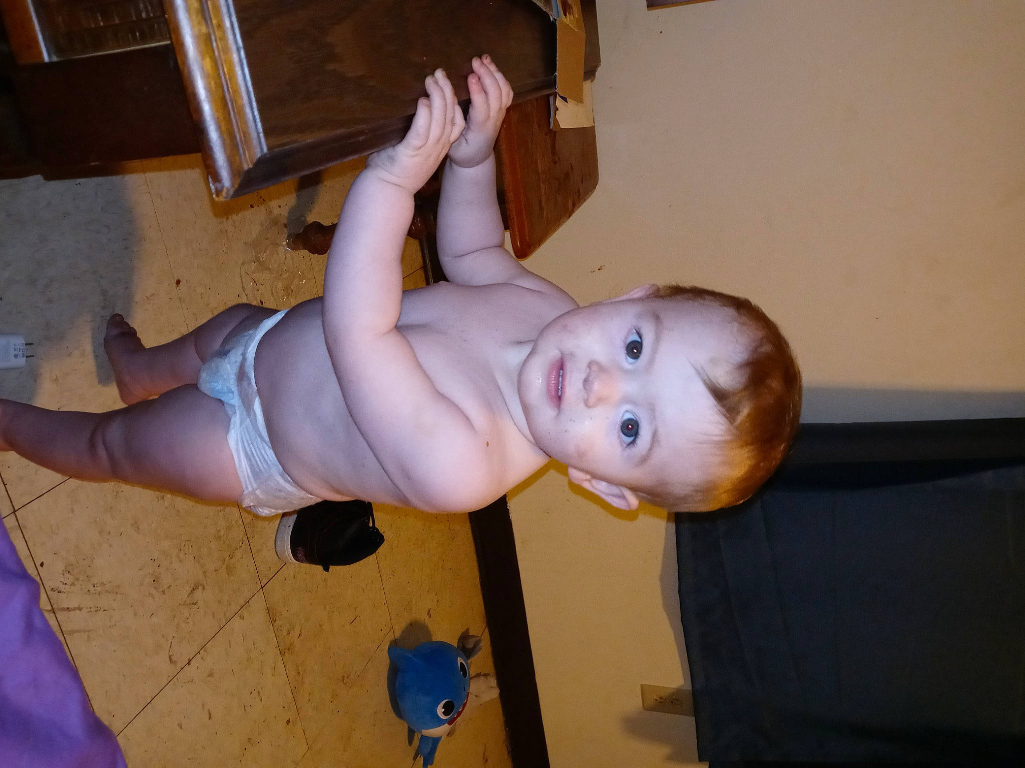 Memphis is registered to the contest to win money with this photo: baby, baby_toddler_clothing, chest, chin, elbow, finger, floor, flooring, foot, fun, human_leg, joint, knee, leg, nose, person, thigh, thumb, toddler, trunk