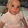 Kaila joined the competition — help win amazing prizes! toddler, child, baby, pink_bow, headband, pink_outfit, indoor, bedspread, patterned_bedspread, seated, curious_expression, brown_eyes, soft_lighting, portrait, young_child, cute, person, face, infant, clothing