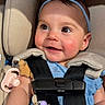 baby, child, smile, headband, car_seat, safety_harness, pacifier, beads, sunlight, close_up, happy, infant, cute, portrait, blue_clothing, skin, face, eyelashes, cheeks, seat