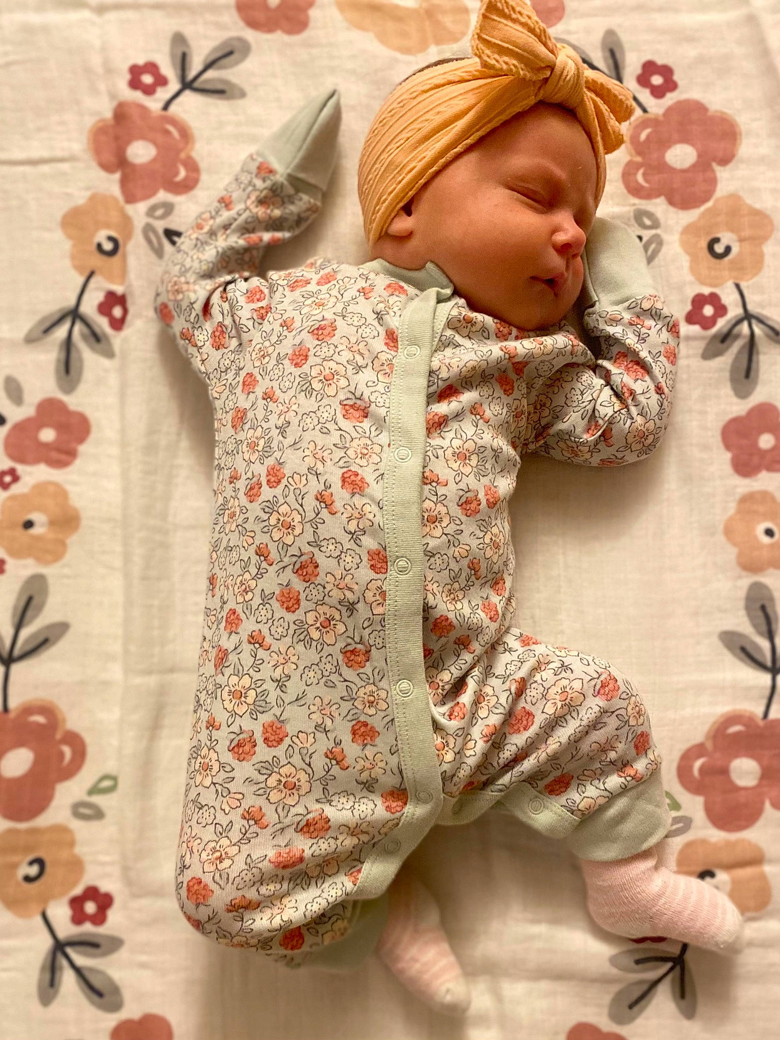 Kashton is registered to the contest to win money with this photo: baby, baby_toddler_clothing, cap, child, creative_arts, doll, dress, flooring, linens, ornament, outerwear, pattern, peach, person, pink, sleeve, stuffed_toy, textile, toddler, wool