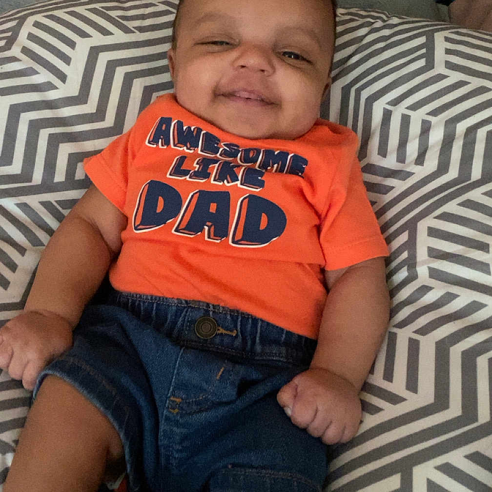 Vsean is registered to the contest to win money with this photo: baby, clothing, couch, cushion, face, furniture, happy, head, homedecor, indoors, jeans, pants, person, photography, portrait, shorts, sitting, sleeping, smile, t_shirt