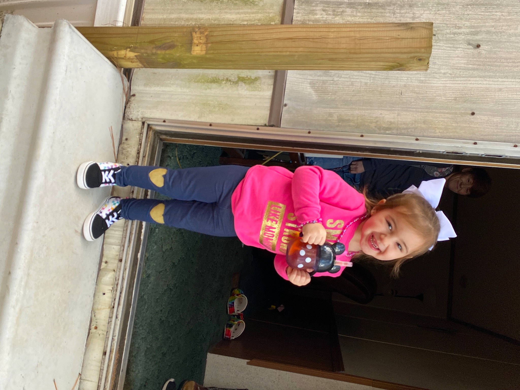 Emory joined the competition — help win amazing prizes! baby_toddler_clothing, boot, child, door, facade, footwear, fun, hat, house, joy, leisure, magenta, outdoor_shoe, person, plant, recreation, shoe, street_fashion, toddler, tree