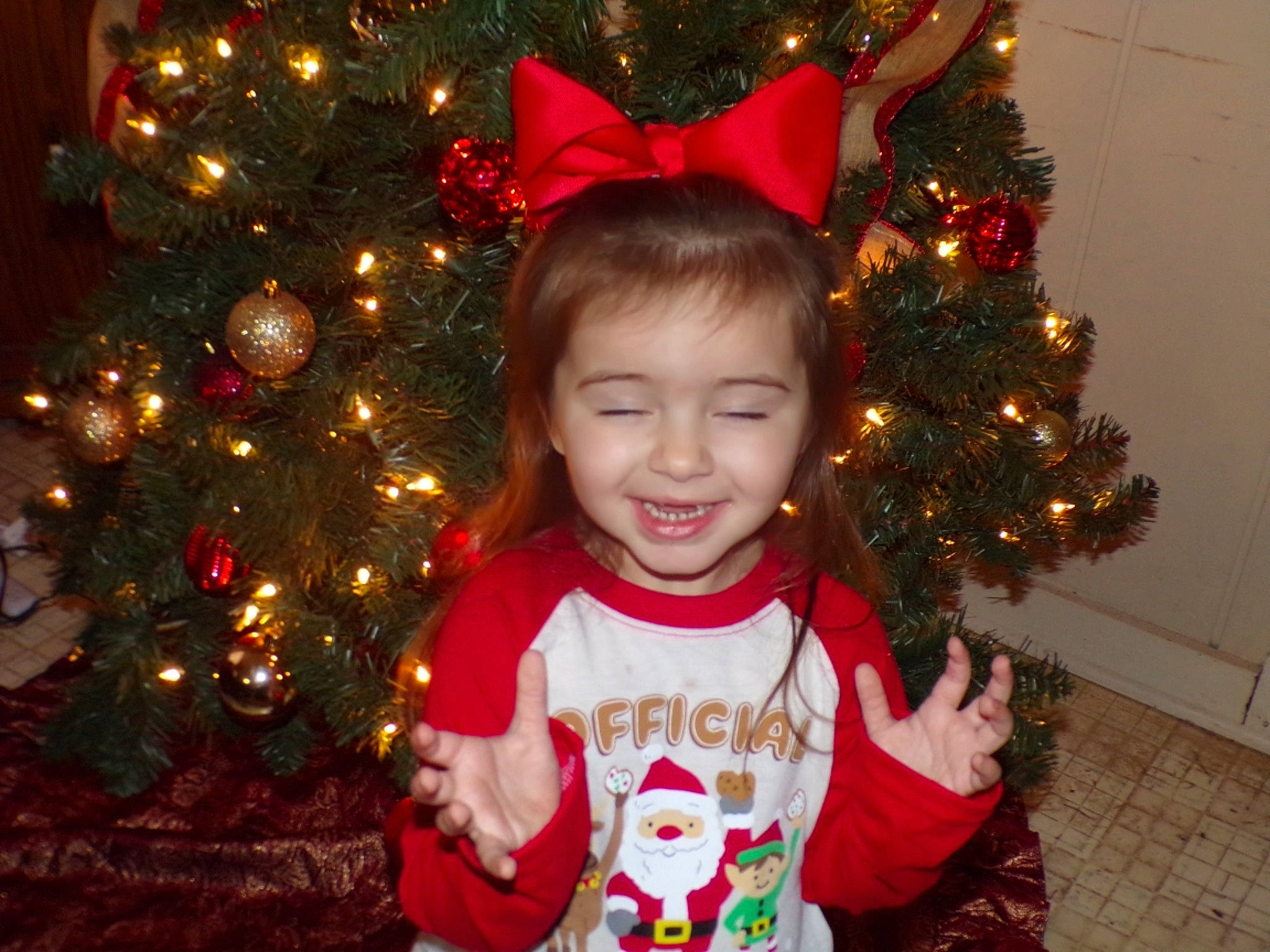 Emory joined the competition — help win amazing prizes! baby_toddler_clothing, christmas, christmas_decoration, christmas_ornament, christmas_tree, event, evergreen, facial_expression, happy, holiday_ornament, joy, light, organ, ornament, person, red, shortstraw_pine, sleeve, smile, toddler