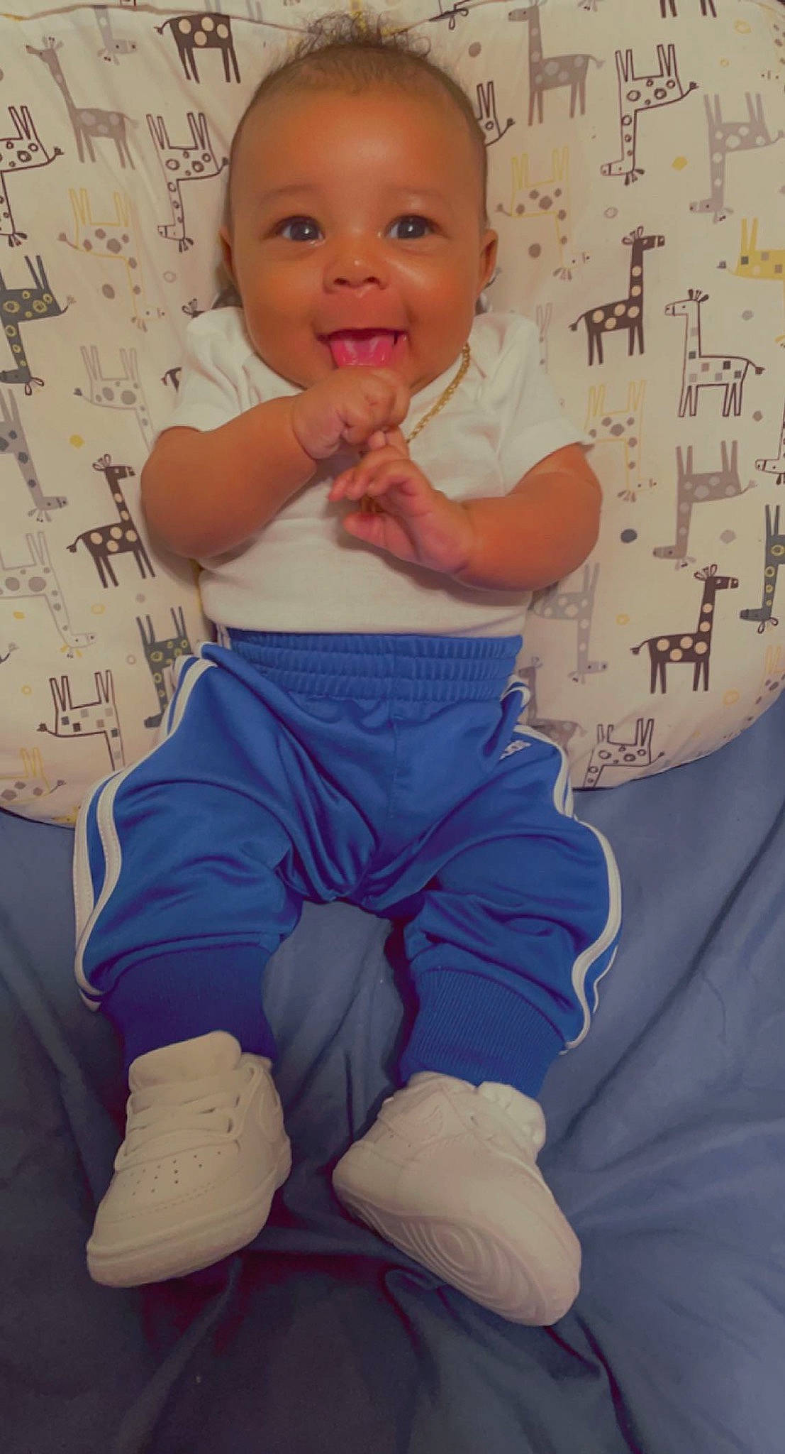 Hezekiah joined the competition — help win amazing prizes! baby_toddler_clothing, cheek, child, facial_expression, finger, hairstyle, happy, head, human, joint, knee, leg, person, photograph, pink, skin, sleeve, smile, standing, toddler