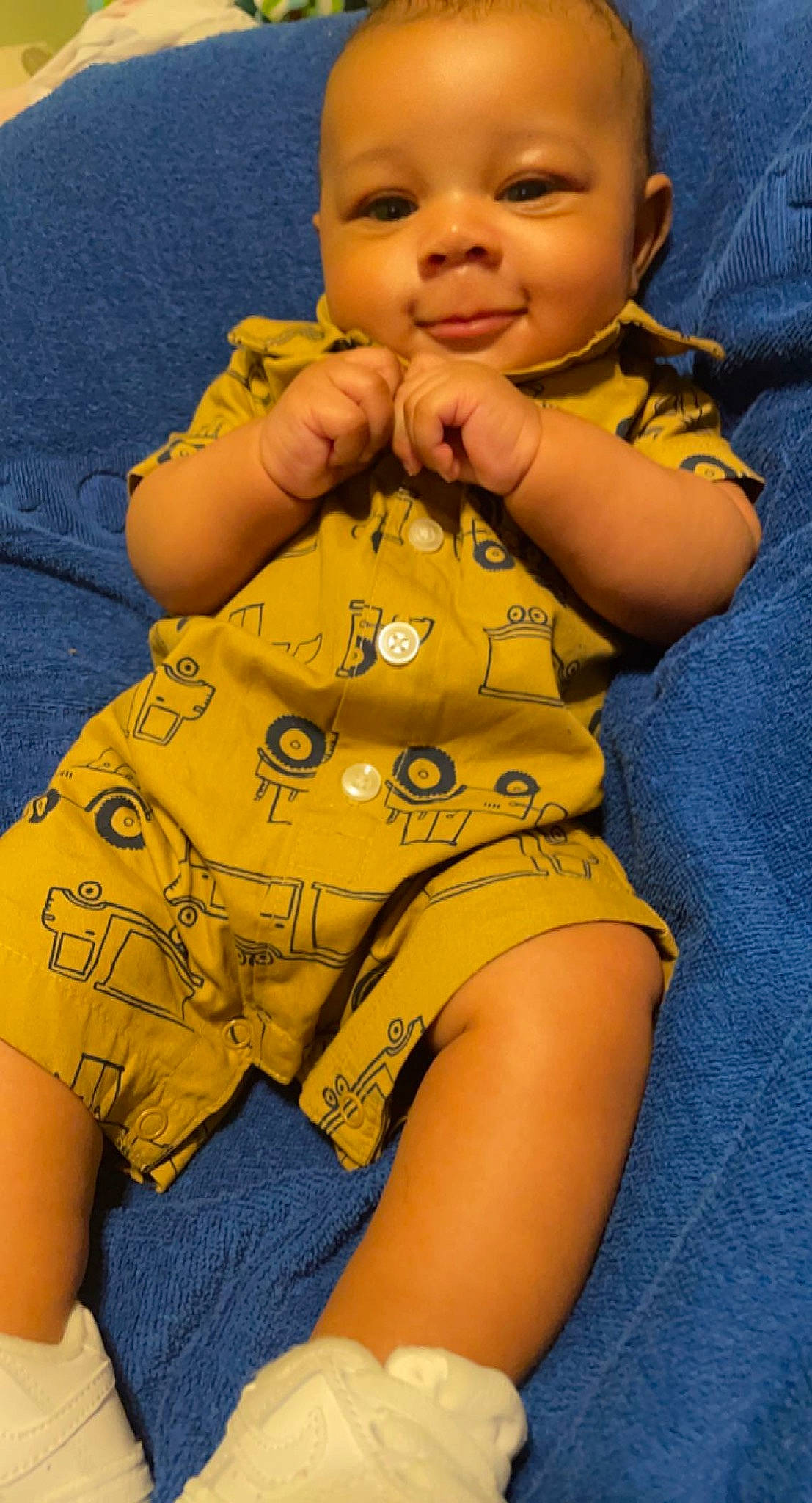 Hezekiah is registered to the contest to win money with this photo: baby, baby_toddler_clothing, cheek, comfort, finger, gesture, hair, happy, head, human_body, leg, nose, person, skin, sleeve, smile, thigh, thumb, toddler, trunk