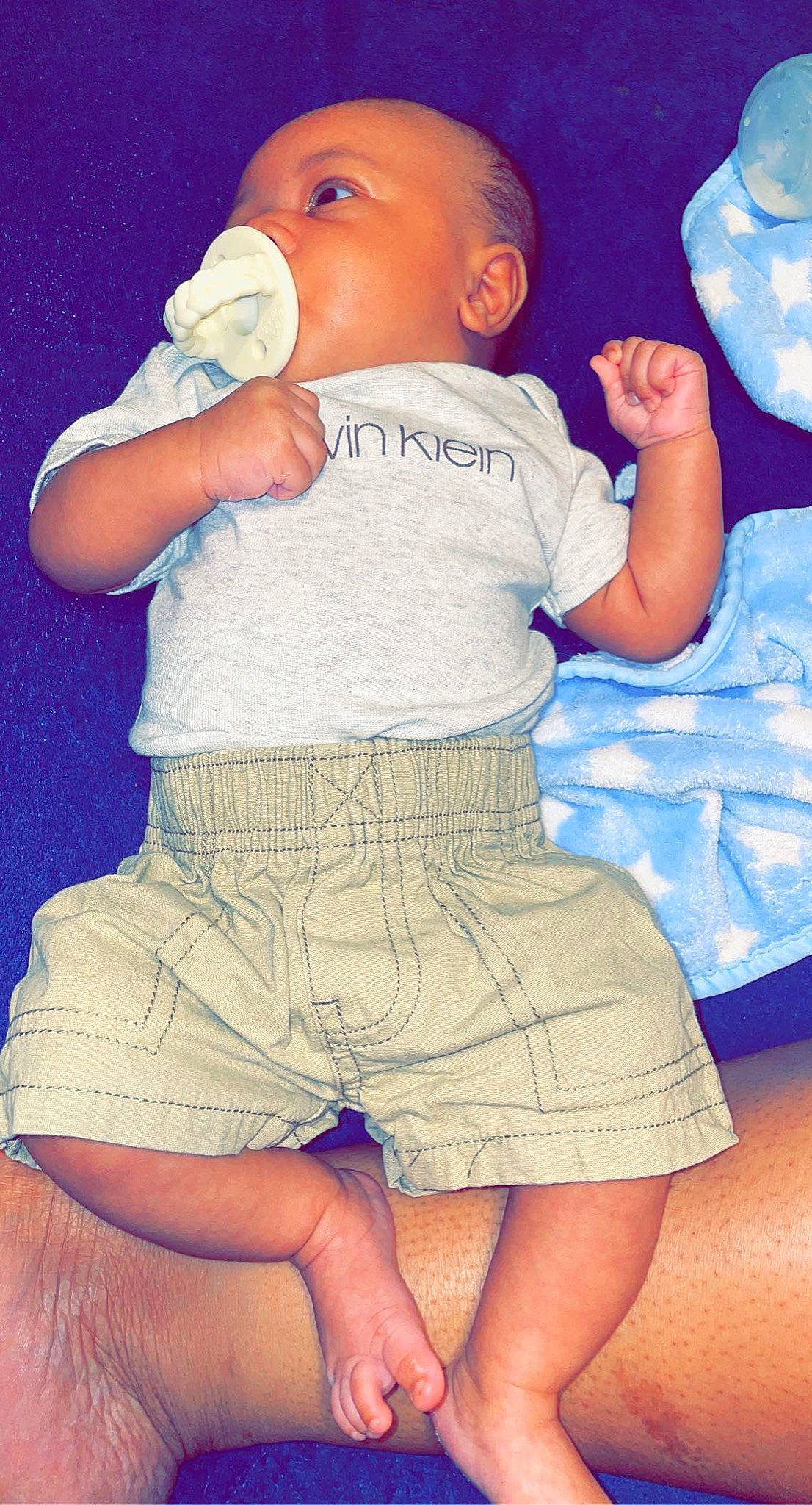 Hezekiah joined the competition — help win amazing prizes! baby_toddler_clothing, blue, facial_expression, finger, gesture, hand, human_body, joint, leg, muscle, one_piece_garment, organ, person, pink, skin, sleeve, thigh, toddler, waist, white