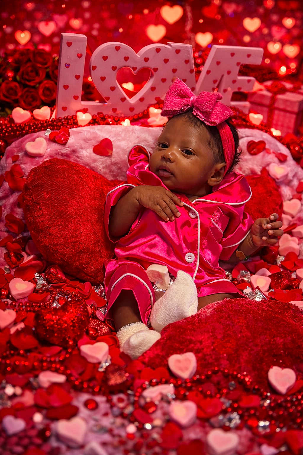 Alynncia joined the competition — help win amazing prizes! baby, infant, pink_pajamas, headband, bow, heart_shapes, red_hearts, pink_hearts, plush_pillows, love_sign, valentine_theme, beads, decorations, cute, portrait, indoor, celebration, holiday, soft_toys, relaxed