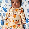 Myles joined the competition — help win amazing prizes! baby, blanket, blue, child, clothing, cute, elephant_pattern, expression, eyes, face, feet, hands, indoors, infant, lying_down, newborn, onesie, sleepwear, soft_texture, white